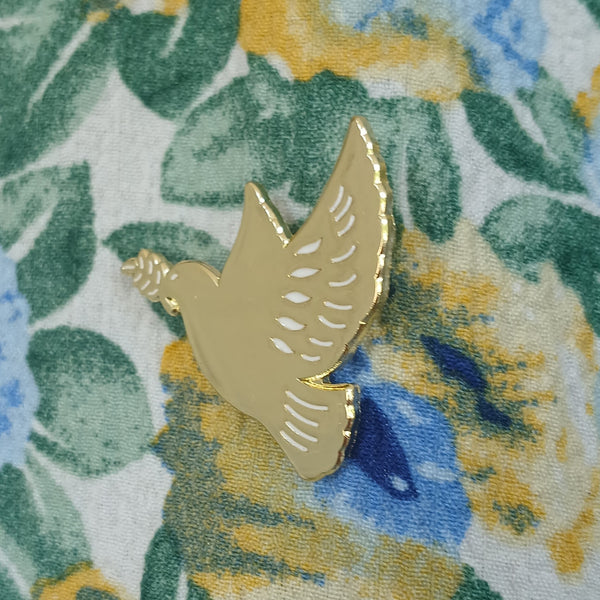 Pin's colombe dorée